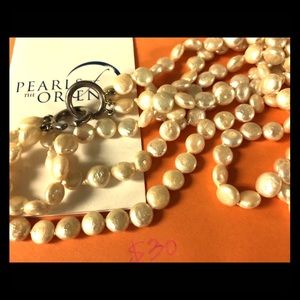 Double string of cultured pearls